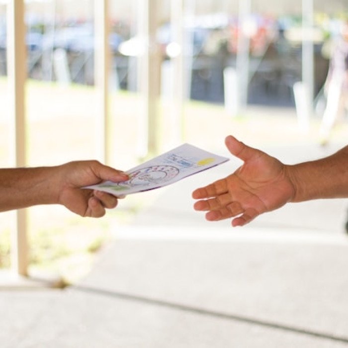 Printed marketing materials including brochures, flyers and booklets laid out in funnel stages