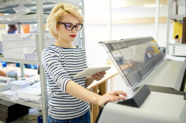 large format printing person in london print shop