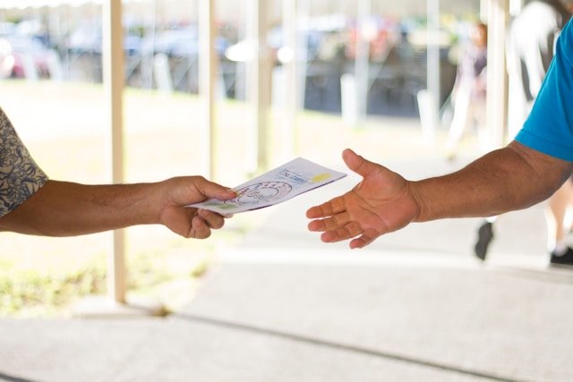 Printed marketing materials including brochures, flyers and booklets laid out in funnel stages